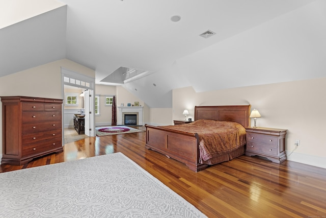 360 New London Tpke, Stonington, CT 06378 - bedroom featuring wood finished floors, vaulted ceiling, and attic access