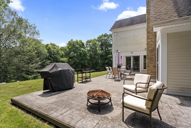 360 New London Tpke, Stonington, CT 06378 - view of patio featuring an outdoor fire pit, a grill, french doors, and outdoor dining area