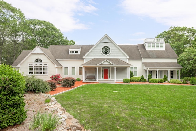 360 New London Tpke, Stonington, CT 06378 - shingle-style home featuring a porch, a front yard, and roof with shingles