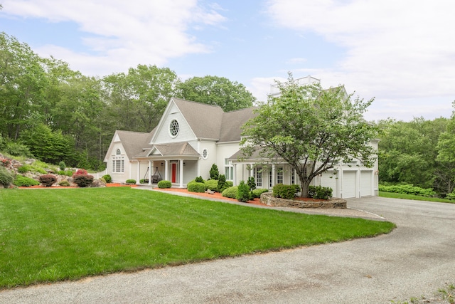 360 New London Tpke, Stonington, CT 06378 - view of front facade featuring asphalt driveway, a front lawn, and covered porch