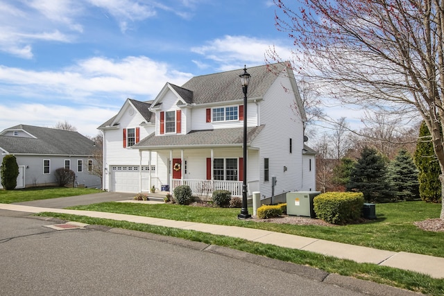 36 Barbers Way Unit 36, Hebron, CT 06248 - traditional-style home with a porch, a front lawn, a garage, a shingled roof, and driveway