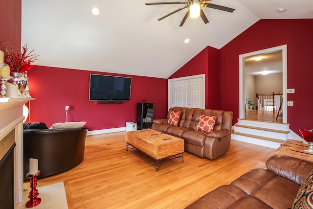 36 Barbers Way Unit 36, Hebron, CT 06248 - living room featuring lofted ceiling, a fireplace with flush hearth, baseboards, light wood-type flooring, and a ceiling fan