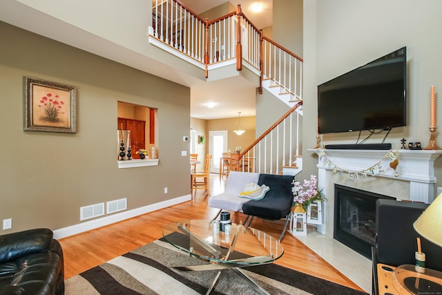 36 Barbers Way Unit 36, Hebron, CT 06248 - living room with baseboards, visible vents, wood finished floors, and stairs