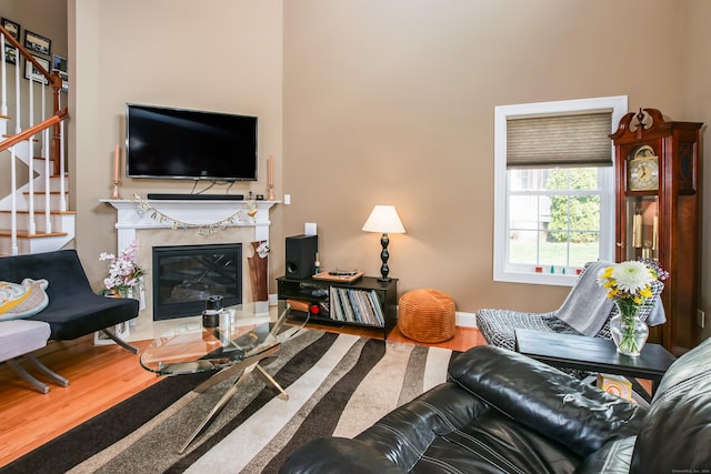 36 Barbers Way Unit 36, Hebron, CT 06248 - living area featuring baseboards, wood finished floors, stairs, and a fireplace
