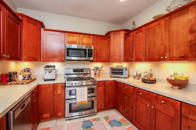 36 Barbers Way Unit 36, Hebron, CT 06248 - kitchen featuring a toaster, dark brown cabinets, stainless steel appliances, and light countertops