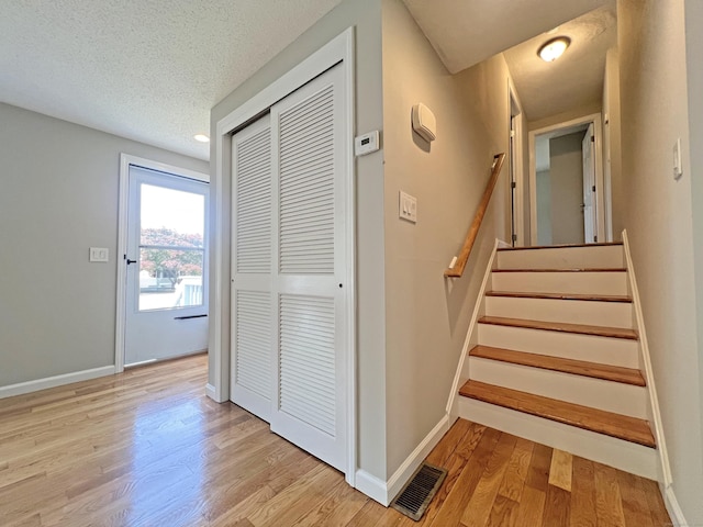 6 Perron Rd, Plainville, CT 06062 - stairway featuring wood finished floors and a textured ceiling