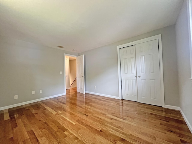 6 Perron Rd, Plainville, CT 06062 - unfurnished bedroom with light wood-style flooring and a closet