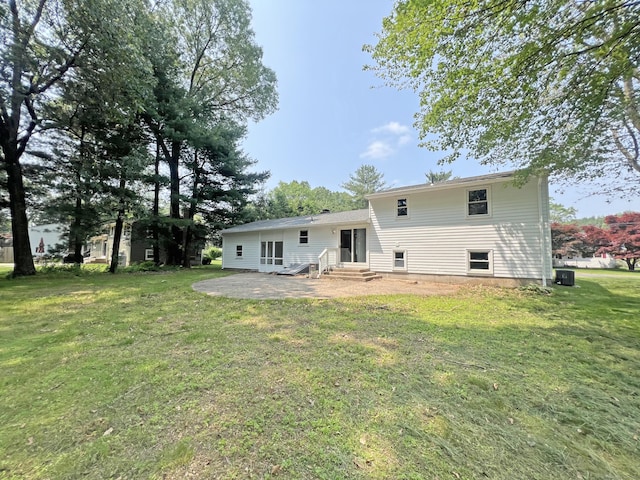6 Perron Rd, Plainville, CT 06062 - rear view of property featuring entry steps, a patio, and a yard