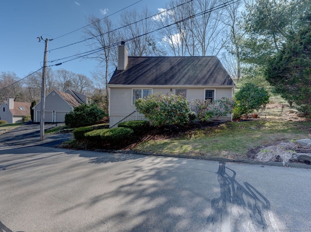 20 Copper Hill Dr Unit 20, Guilford, CT 06437 - view of property exterior featuring a chimney and a detached garage
