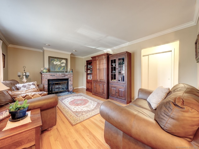 20 Copper Hill Dr Unit 20, Guilford, CT 06437 - living room featuring crown molding, light wood-type flooring, and a brick fireplace