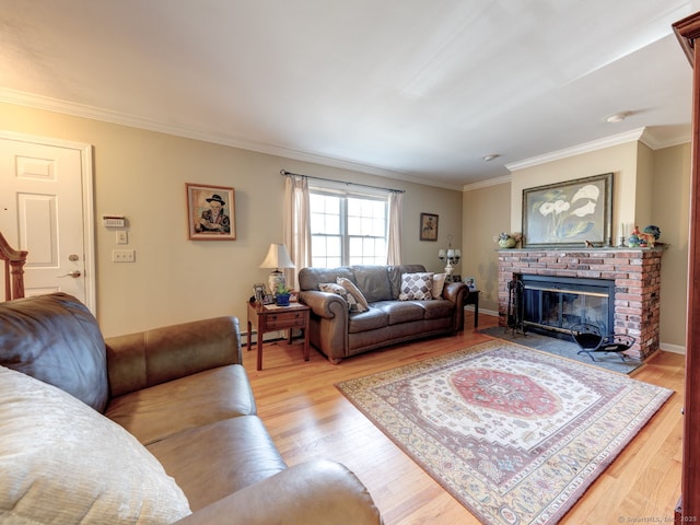 20 Copper Hill Dr Unit 20, Guilford, CT 06437 - living room with crown molding, baseboards, light wood-style flooring, and a brick fireplace