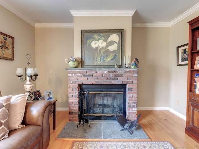 20 Copper Hill Dr Unit 20, Guilford, CT 06437 - living room featuring baseboards, ornamental molding, wood finished floors, and a brick fireplace