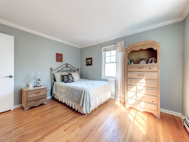 20 Copper Hill Dr Unit 20, Guilford, CT 06437 - bedroom featuring baseboards, a baseboard heating unit, light wood-style floors, and crown molding