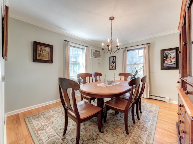 20 Copper Hill Dr Unit 20, Guilford, CT 06437 - dining area featuring a wealth of natural light, baseboard heating, crown molding, and an inviting chandelier