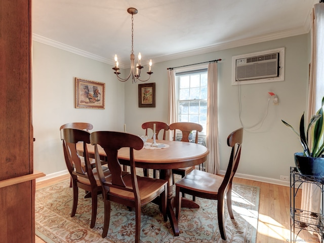 20 Copper Hill Dr Unit 20, Guilford, CT 06437 - dining space with a wall mounted AC, light wood-style floors, ornamental molding, and a chandelier