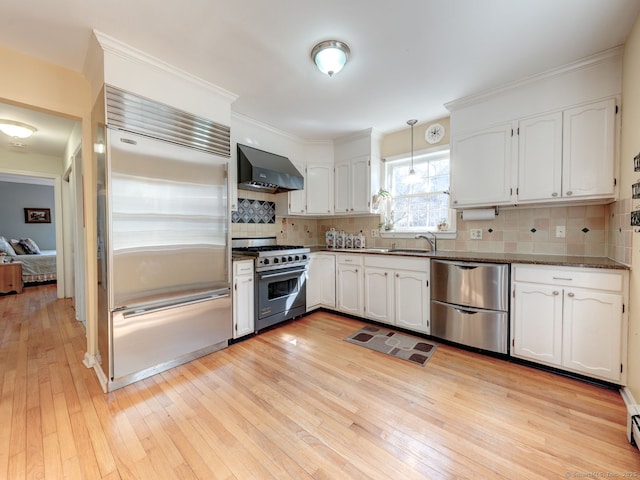 20 Copper Hill Dr Unit 20, Guilford, CT 06437 - kitchen featuring light wood-style floors, white cabinets, wall chimney exhaust hood, and high end appliances