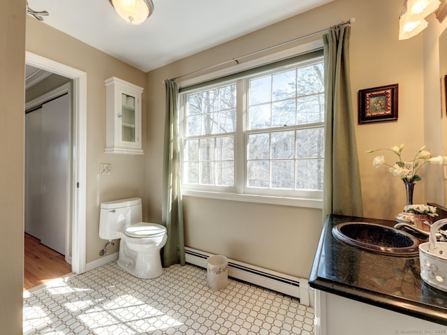 20 Copper Hill Dr Unit 20, Guilford, CT 06437 - bathroom with a baseboard radiator, toilet, vanity, and baseboards