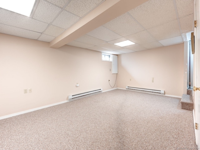 20 Copper Hill Dr Unit 20, Guilford, CT 06437 - basement featuring baseboards, carpet flooring, a drop ceiling, and a baseboard heating unit