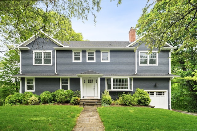 3 Burchard Ln, Norwalk, CT 06853 - shingle-style home with a chimney, a front lawn, a garage, and roof with shingles