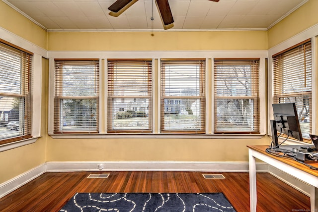 unfurnished office with a healthy amount of sunlight, ceiling fan, and visible vents