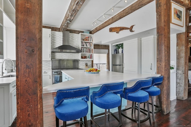 5 Deerfield Rd, Wilton, CT 06897 - kitchen featuring wall chimney exhaust hood, appliances with stainless steel finishes, backsplash, dark wood-style flooring, and a sink