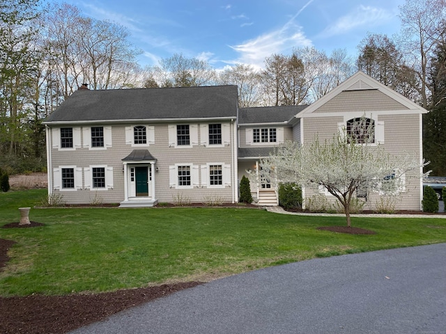 2 Whispering Pines Ln, Goshen, CT 06756 - colonial inspired home with a shingled roof, a chimney, and a front lawn