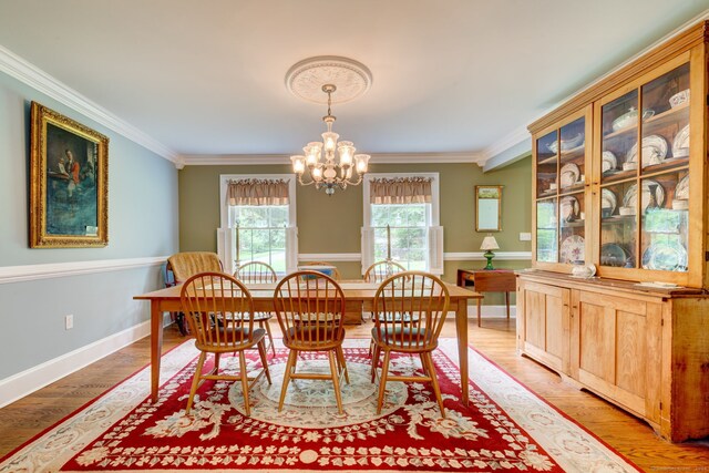 2 Whispering Pines Ln, Goshen, CT 06756 - dining space with crown molding, baseboards, light wood-style flooring, and a chandelier