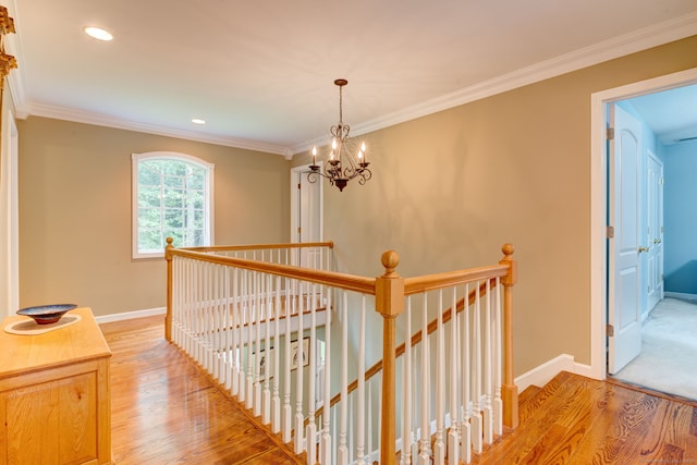 2 Whispering Pines Ln, Goshen, CT 06756 - hallway featuring light wood-style floors, baseboards, an upstairs landing, and an inviting chandelier