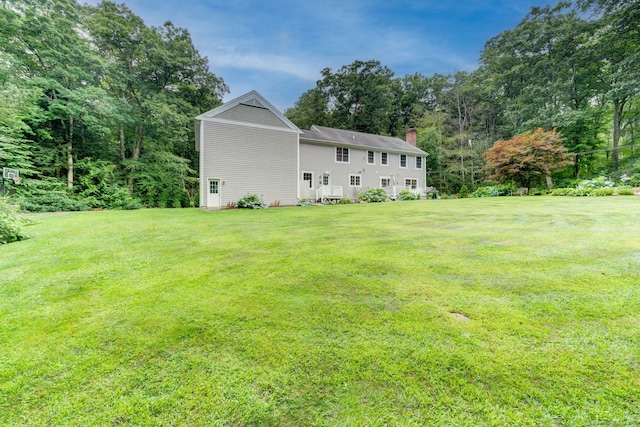 2 Whispering Pines Ln, Goshen, CT 06756 - back of house featuring a yard and a chimney