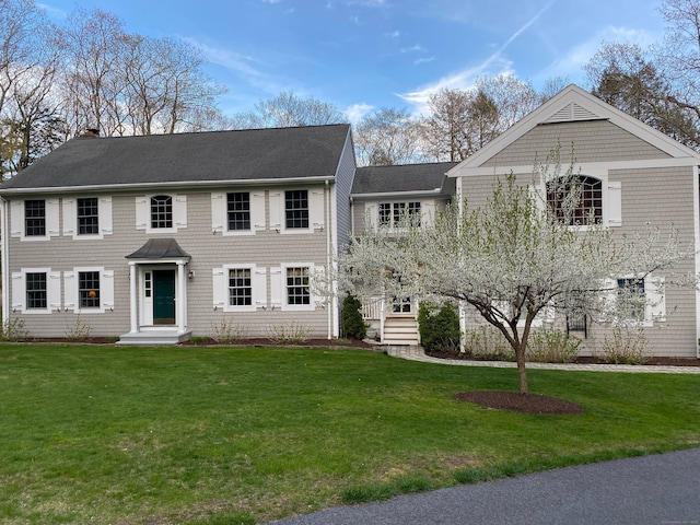 2 Whispering Pines Ln, Goshen, CT 06756 - view of front of home with a front lawn, roof with shingles, and a chimney