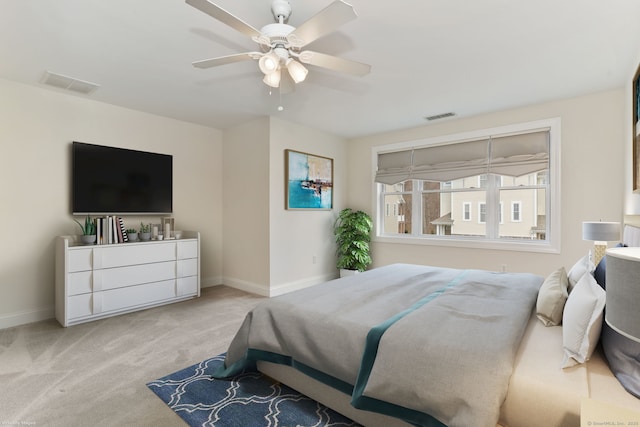 bedroom featuring visible vents, baseboards, carpet flooring, and ceiling fan