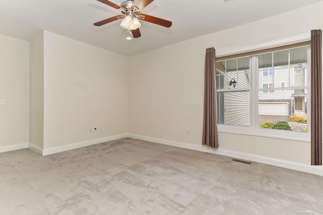 carpeted empty room featuring recessed lighting, visible vents, baseboards, and ceiling fan