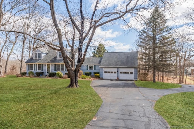 cape cod home with a front lawn, driveway, a shingled roof, and an attached garage