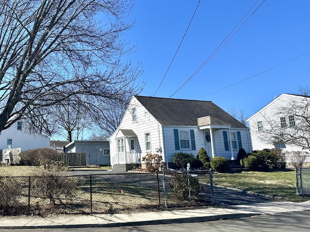 view of front of property featuring a gate, a fenced front yard, and roof with shingles