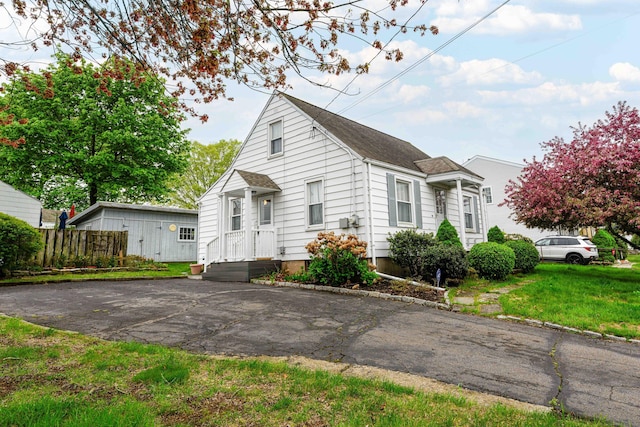 95 Vista Dr, East Haven, CT 06512 - bungalow with a shingled roof, a front lawn, and fence