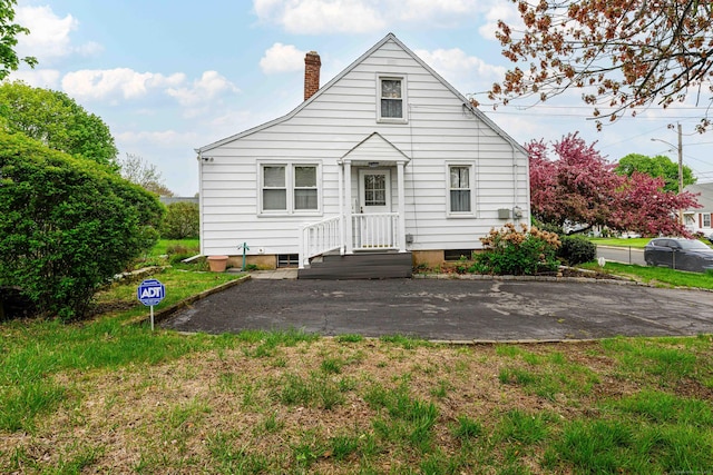 95 Vista Dr, East Haven, CT 06512 - rear view of property featuring a chimney