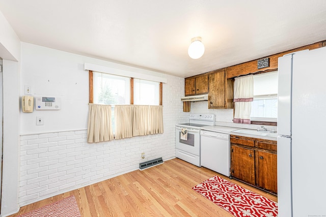 95 Vista Dr, East Haven, CT 06512 - kitchen featuring visible vents, light countertops, a sink, under cabinet range hood, and white appliances