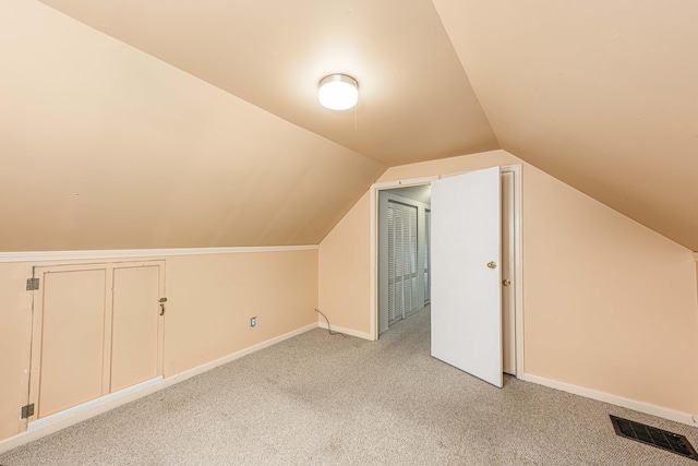 95 Vista Dr, East Haven, CT 06512 - additional living space with visible vents, baseboards, lofted ceiling, and light colored carpet