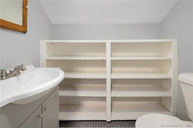 bathroom featuring toilet and vanity