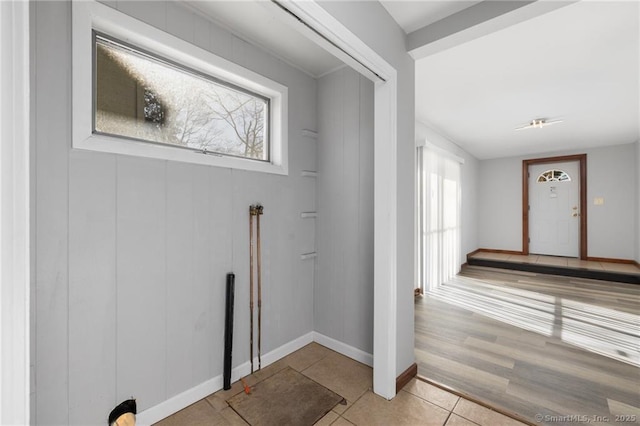 interior space featuring baseboards and tile patterned floors