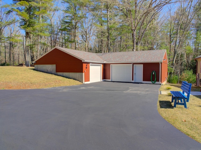 garage with aphalt driveway
