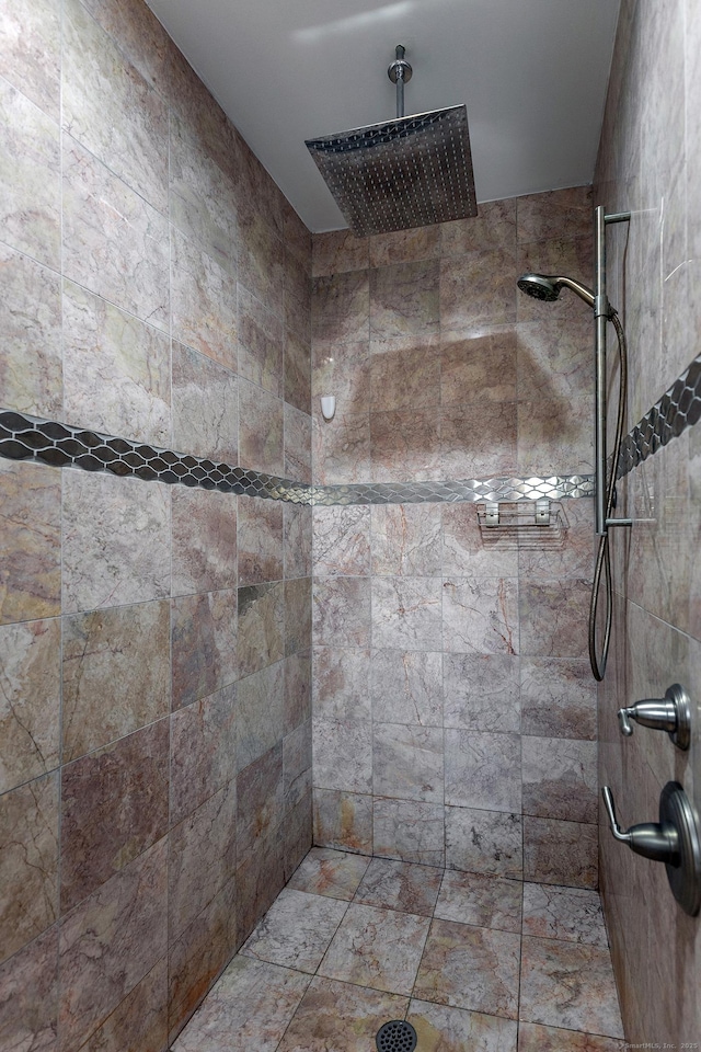 bathroom with tiled shower