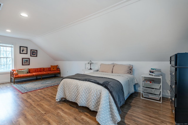 bedroom featuring recessed lighting, baseboards, lofted ceiling, and wood finished floors