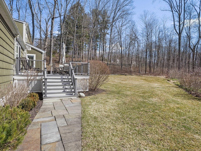 view of yard featuring a wooden deck