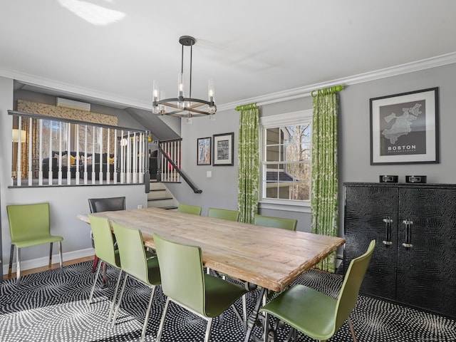 dining space with stairway, an inviting chandelier, ornamental molding, baseboards, and wood finished floors