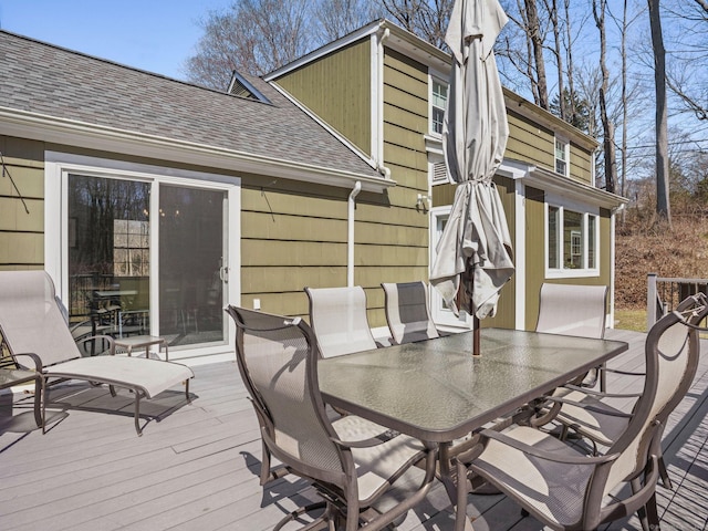 wooden deck featuring outdoor dining space