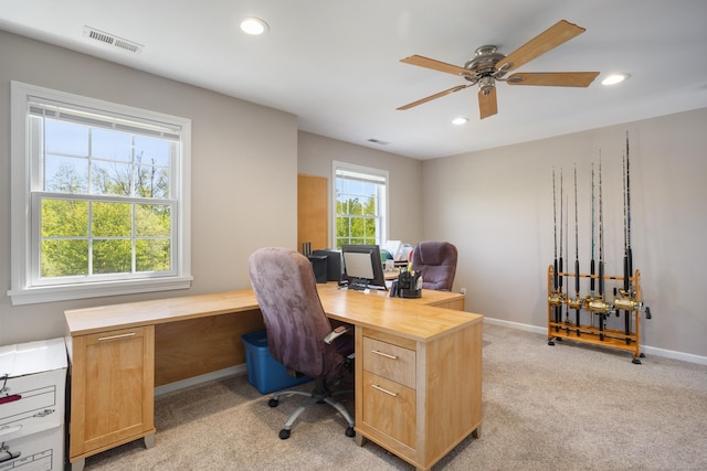 office space featuring light colored carpet, a ceiling fan, recessed lighting, and baseboards