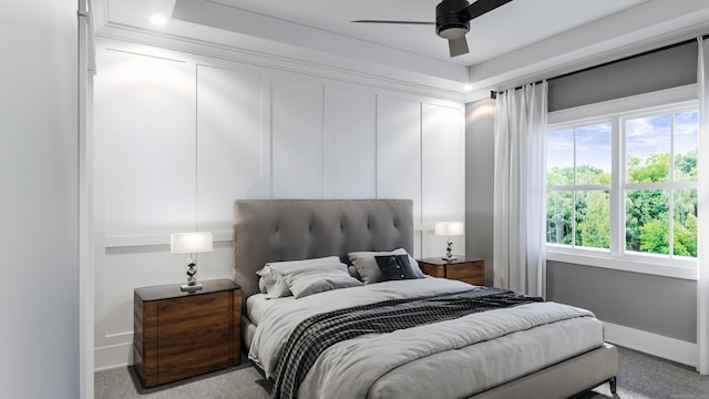 bedroom featuring baseboards, a ceiling fan, and carpet flooring