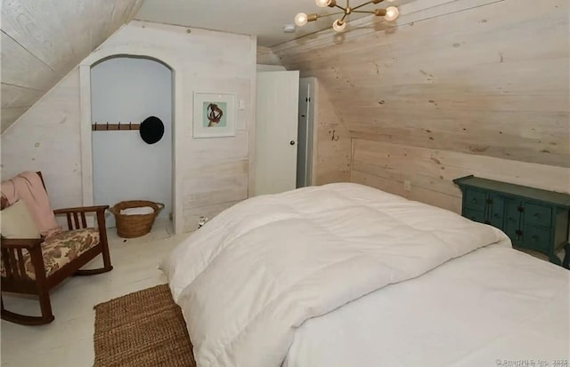 741 Mapleton Ave, Suffield, CT 06078 - bedroom featuring lofted ceiling and wood walls