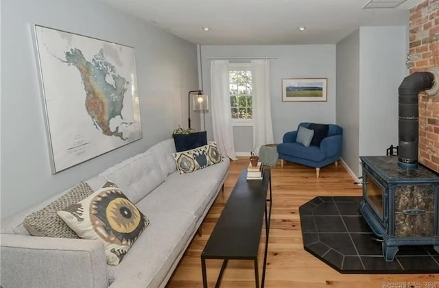 741 Mapleton Ave, Suffield, CT 06078 - living area with a wood stove and wood finished floors